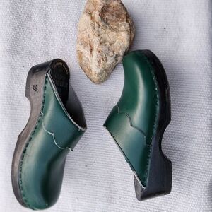 Sven clogs green clog scLloped detail. Wood bottom